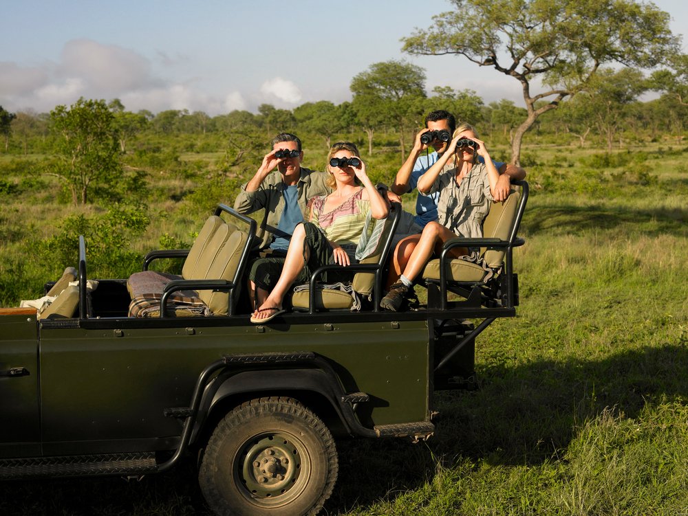 Group of tourists on the field
